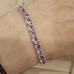 Amethyst tennis bracelet, 925 Sterling silver, rhodium plated, 7.25" length.